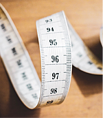 Measuring tape with cm and mm divisions shown.