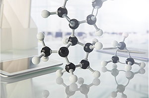 A physical model showing a molecule consisting of atoms of a couple different types.